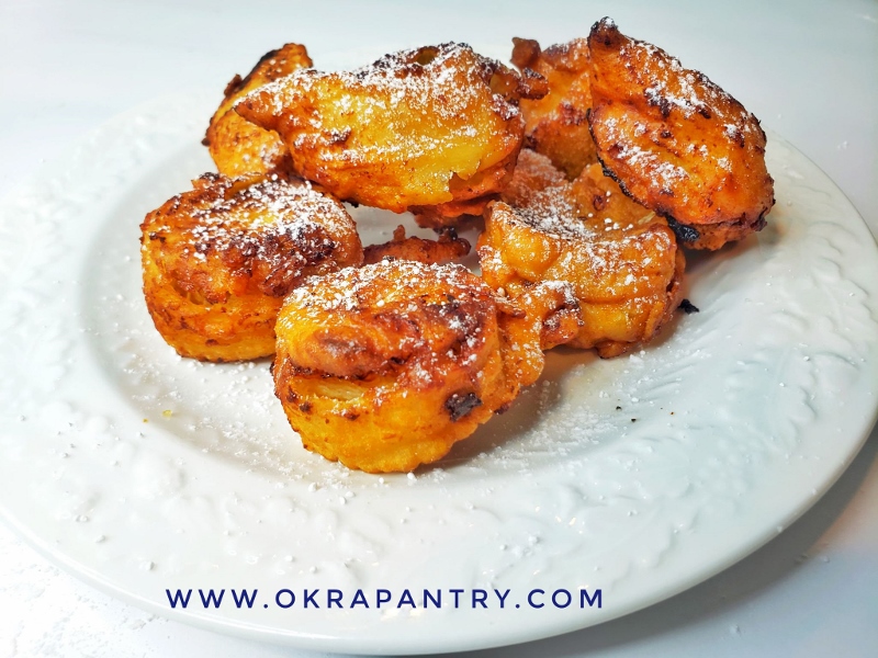 Delicious African Banana Fritter is a tender and very flavorful treat of ripe banana wrap in batter, deep fried until crisp and garnish with confectioner's sugar or any topping of your choice for a memorable treat.