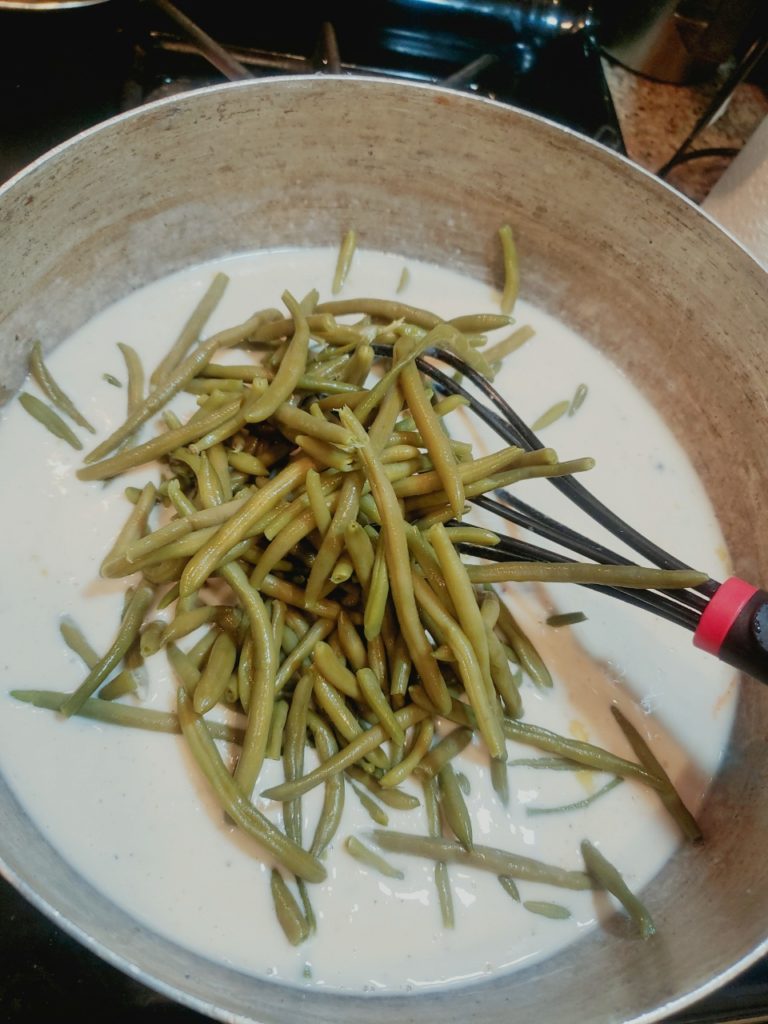 Green bean casserole is a casserole consisting mostly of cooked green beans, cream of mushroom soup, and French fried onions