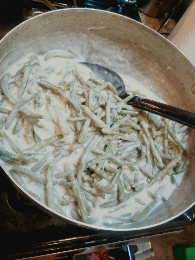 Green bean casserole is a casserole consisting mostly of cooked green beans, cream of mushroom soup, and French fried onions